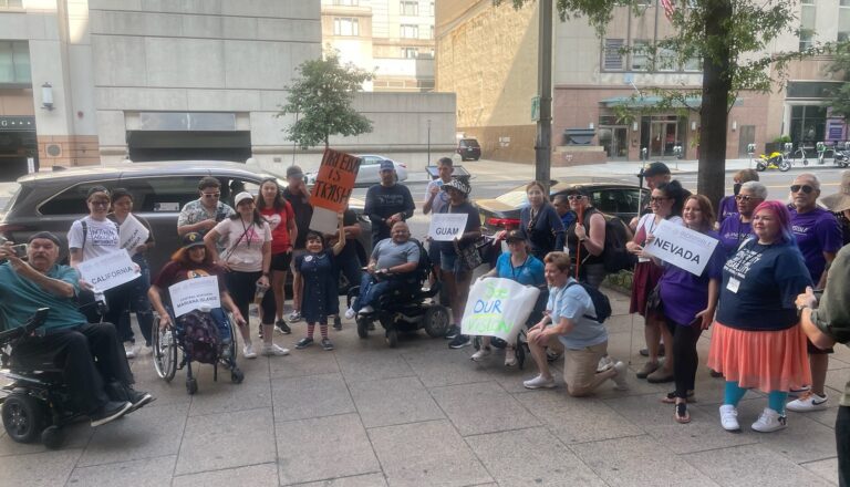 A photo of a group of supporters marching at Washington D.C. in celebration of the 33rd anniversary of the ADA